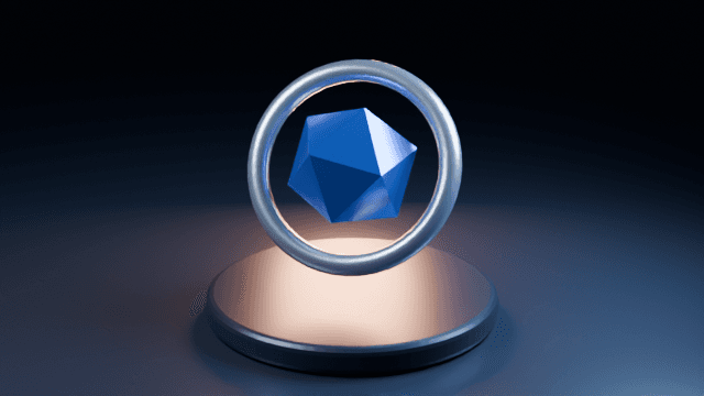 A blue faceted core floating within a silver ring above a studio-lit plinth, rendered in Blender